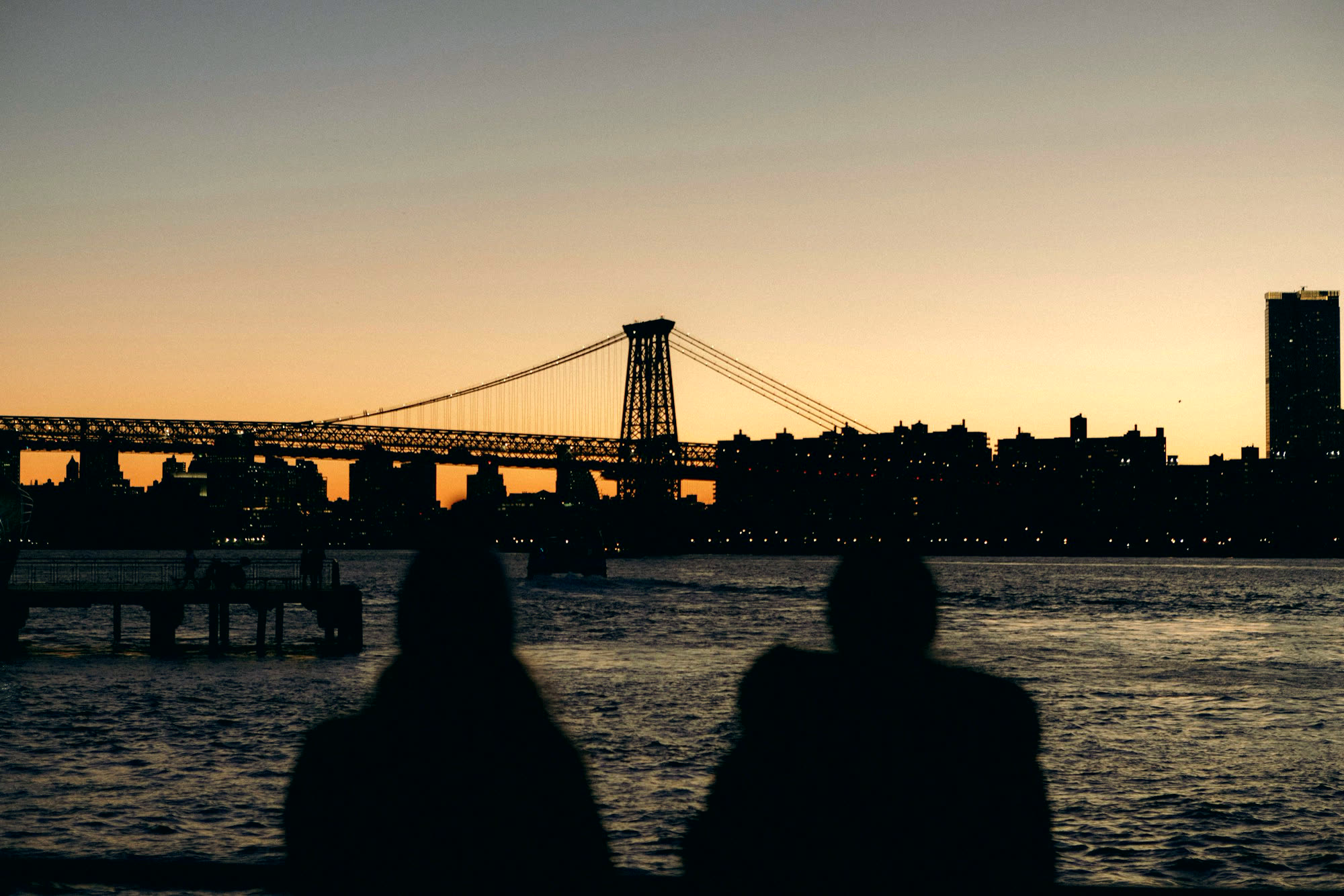 The same shot graded: warm sky, deep silhouettes, cool water.